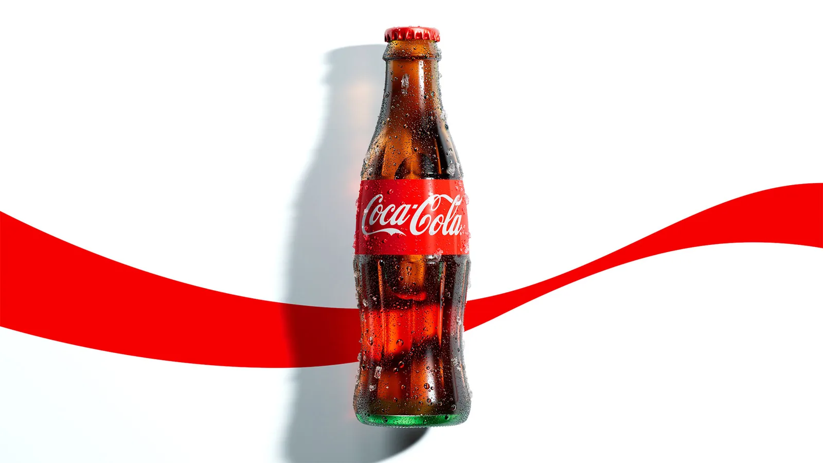 A wet glass Coca-Cola contour bottle standing on a white ground, with the red Dynamic Ribbon sweeping behind it from edge to edge.